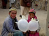 Two Boys with Glove Balloons